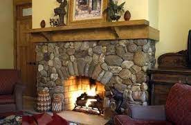Another option for personalizing your fireplace. River Stone Fireplaces Cane River Building Stone Fireplace Fireplaces Indoor Fireplace Building Stone Fireplace Wall