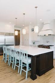 In most cases a kitchen island is designed to serve more than a single purpose. Brown Kitchen Island With Turquoise Blue Counter Stools Contemporary Kitchen