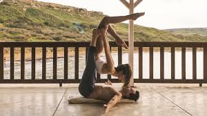 Acro yoga includes a lot of positions in which several yogis are raised in the air, balancing themselves on the hands or torso of the yogi on the ground. Acro Yoga A Romantic And Amazing Flow For Beginners Youtube