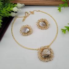 "Gold-Plated Mother-of-Pearl Jewelry Set".