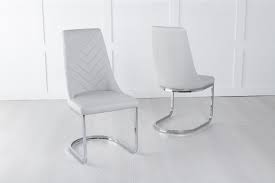 You'll pull up to your kitchen or dining table in comfort and style when you surround it with these great looking chairs. Nova Light Grey Faux Leather Swing Dining Chair With Brushed Metal Base