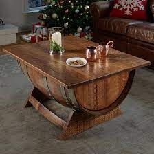 These are unique crafts are made with recycled materials and lumber from local trees. Reclaimed Wine Barrel Coffee Table With Unique Lift Top
