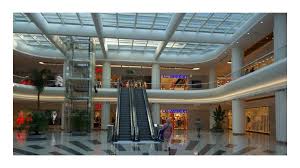 The glass balustrade ensures light is not blocked. Endulus Park Shopping Mall Retractable Glass Roof System