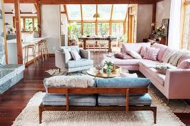 There is a vintage french poster advertising a rocking horse over the television area. We Gave The Friends Apartments A Modern Update