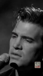 Chris Isaak’s live performance of “Wicked Game” is a masterclass in raw  emotion and haunting melody. His signature falsetto, drenched in longing,  floats over the song’s hypnotic guitar lines, creating ...