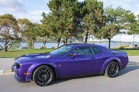 The dodge challenger is the name of three different generations of automobiles (two of those being pony cars) produced by american automobile manufacturer dodge. 2019 Dodge Challenger Scat Pack 392 Widebody Is Plum Crazy Wheels Ca
