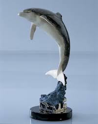 This large bronze coated dolphin sculpture is handcrafted to the finest detail and individually bronze coated. Robert Wyland Dolphin Statue Water By Robert Wyland