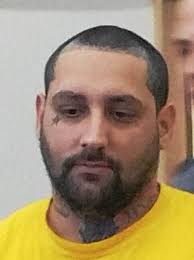 Man accused of robbing gas station employees at gun point