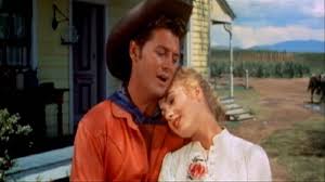 Is a 1999 musical film directed by trevor nunn, choreographed by susan stroman, and starring hugh jackman as curly mclain, josefina gabrielle as laurey williams, and maureen lipman as aunt eller. How Oklahoma Birthed The Modern Musical Udiscover
