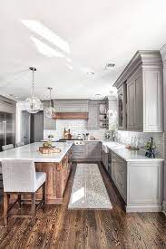 Modern Farmhouse Kitchen With Grey Cabinets And Wooden Accents Farmhousestyle Farmhousekitchen Mode Home Decor Kitchen Interior Design Kitchen Kitchen Style