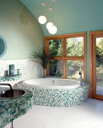 A soft sage wall color picks up the accent hue, while wood floors and natural materials complement the other warm neutrals found in the rug. Mesmerizing Green Bathroom Interior Designs Ideas
