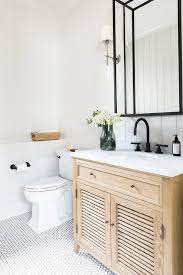 The freestanding design is easy to place in any bathroom, just be sure to take note of the overall dimensions. Oak Shutter Bath Vanity With Marble Top Cottage Bathroom