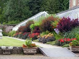 Flowers In Garden Slope Google Search Sloped Garden Lawn And Garden Front Yard Landscaping