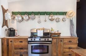 This is a beautiful pot rack that has five movable hooks on it. Ideas For Hanging Pots Pans From Real Homes Apartment Therapy