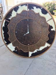 Shop our best selection of decorative wall clocks to reflect your style and inspire your home. Cowhide Decorative Wall Clocks 8211 Western Decor Western Decor Clock Wall Decor Decor