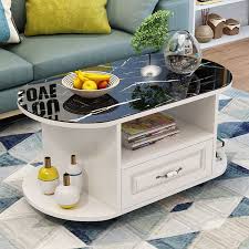 An oval coffee table can soften the look of a living room or family room as it offers added storage for drinks, snacks, magazines, and books. Tempered Glass Top Coffee Table Oval Sofa Table With Wheels Drawer Storage Space Small Apartment Living Room Home Furniture Coffee Tables Aliexpress