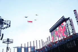 An enthusiastic audience numbering hundreds of thousands gathers to view the procession of invited bands, military and specialty units, and floats. Singapore Celebrates Bicentennial Featuring Scdf S First Volunteer Marching Contingent Scdf