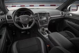 2017 Jeep Grand Cherokee Srt Interior A Dashboard With A Large Screen Jeep Grand Cherokee 2017 Jeep Grand Cherokee Jeep