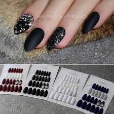 This set of nails has to be one of my favorites of all time. Stiletto Matte Black Glitter False Nails Crystal Full Sets Salon Design Blue Fake Nails Red Customizable Almond White Gel Nail Kiss Nails From Ruhui 31 39 Dhgate Com
