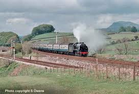 Painted dark grey to match the table, chairs have broad horizontal back slats and comfortable. David Heys Steam Diesel Photo Collection 05 Train Spotters 2