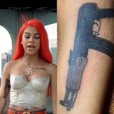 Rihanna's little side gun tattoo. 33 Great Gun Tattoos With Meanings And Celebrities Body Art Guru