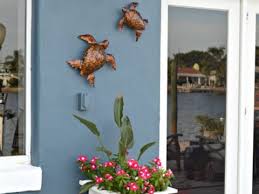 Mark the location of the mounting brackets using a pencil at the desired height. How To Hang Outdoor Wall Decor Without Nails H2obungalow