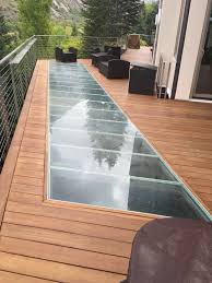 6 Truly Remarkable Things About Glass Floors And Stairs Glass Floor Backyard Patio Building A Deck