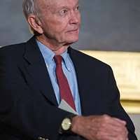 Sen. Dick Durbin, center background, the committee