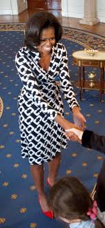 Black And White Wrap Dress With Red Pumps Incredible Michelle Obama Fashion Fashion Michelle Obama