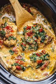 Crockpot Tuscan Garlic Chicken Thighs With Spinach And Sun Dried Tomatoes Chicken Crockpot Recipes Recipes Garlic Chicken Recipes