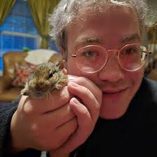 World Traveler Harry has left Kenya for Uganda! Hanging with the giraffes  and such (still sporting a cool hat purchased to avoid sunstroke at  Kilimanjaro). What an adventurer. So proud of this