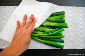 It's not a tip to keep away the smell, but it's a note to keep the onion from rotting in your fridge (which is more disgusting than the smell). How To Store Green Onions Scallions My Korean Kitchen