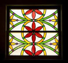 Glazing is applied to the large stained glass window on the church's north side. Guide To Stained Glass Window Coverings Types Options Lovetoknow