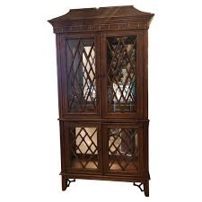 Chinese cabinet makers only use plywood construction because the cabinets come over on boats. Vintage Chinese Chippendale Rattan Bamboo Pagoda Greek Key Display Cabinet At 1stdibs