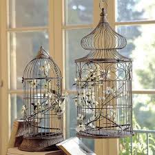 For some, having a birdcage without a bird inside it is not really what they would call beauty while others don't mind a cage as long as it's designed and decorated carefully. Romantic Flower Arrangements In Hanging Birdcages