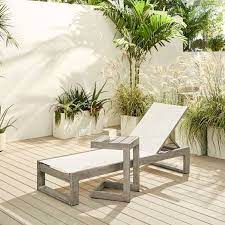 Make sure your favorite beverage, reading material and sunglasses are right at your finger tips with this beautiful, durable and elegant addition to your outdoor seating area. Portside Outdoor Textilene Chaise Lounger C Shaped Side Table Set