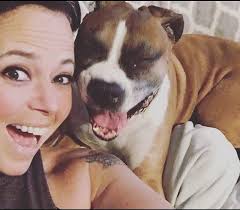Photo of my first boxer and I hamming it up for the camera. She was 11  years old. Miss her so much. I feel like she would be so happy that we