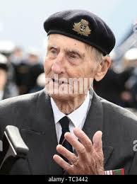 97-year-old World War II Veteran Louis Jimenez and his nephew Vietnam  Veteran Enrique Flores salute the flag Nov. 4 during the Brooke Army  Medical Center Veterans Day Celebration. (U.S. Army photo by