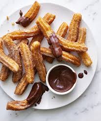 Classic Fried Desserts You Can Make At Home Fried Dessert Churros Recipe Chocolate Sauce Recipes