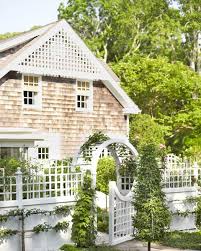 A plain full board privacy fence is fixed with shelves which house a variety of herbs and vegetables. 19 Practical And Pretty Garden Fence Ideas Best Materials To Fence A Garden