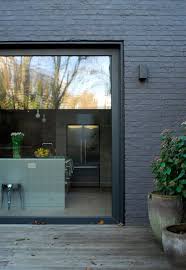 Black And Grey Brick Houses Trend For 2017 Painted Brick House Paint Exterior Facade House Painted Brick Exteri In 2020 Exterior Painted Brick House House Paint Exterior Brick Exterior House