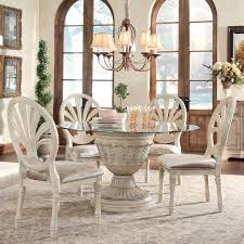 Ortanique 5 Piece Glass Top Table Set With Pierced Oval Back Chairs By Ashley Millennium Www Round Dining Room Sets Round Dining Room Round Dining Room Table