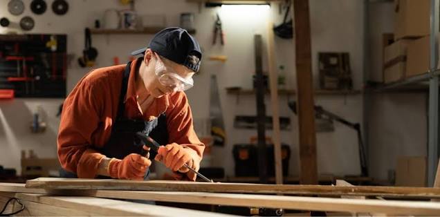 Clock House home fitter assembling bed frame and headboard