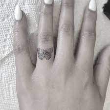 Butterfly Tattoo On The Ring Finger Butterfly Finger Ring Tattoo Finger Tattoos Ring Finger Tattoos Finger Tattoo For Women