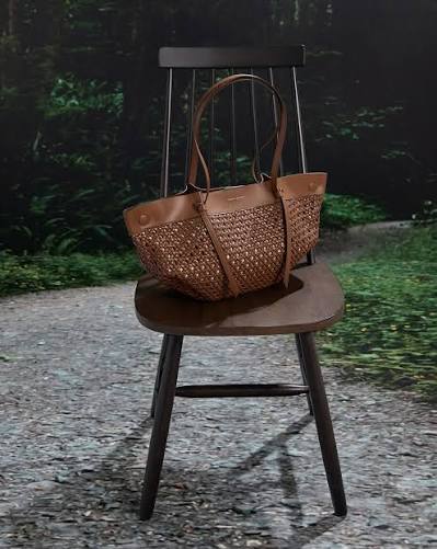 The Calla tote is back in a summer-chic woven finish. Shop now via the link  in bio. #SummersCalling Products featured: Calla Woven Tote Bag