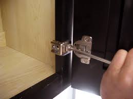 Wrap the hinges around the cabinet so they're flush. How To Install And Level Cabinet Doors How Tos Diy