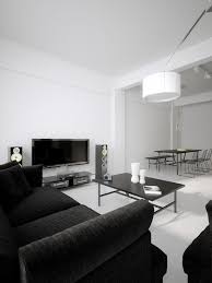 White accents balance a black wall and black bed, creating a bedroom that feels as cozy as can be. Modern Minimalist Black And White Lofts Black And White Living Room Living Room White White Living Room Decor