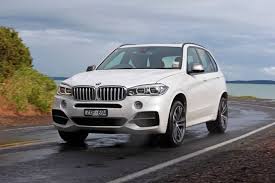 With brown, quilted seating upholstery, glowing purple lights from under and around every surface, twinkling night lights. Review Bmw X5 M50d Review And Road Test