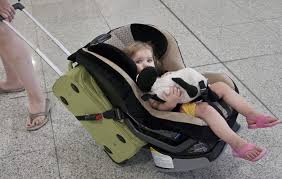 Strap Your Kid S Car Seat To A Rolling Carry On Bag As An Easy Way To Carry It And Your Kid Through The Airport Car Seats Traveling With Baby Travel With Kids