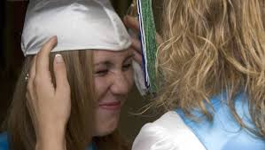 Diplomas in hand, grads start life's ride